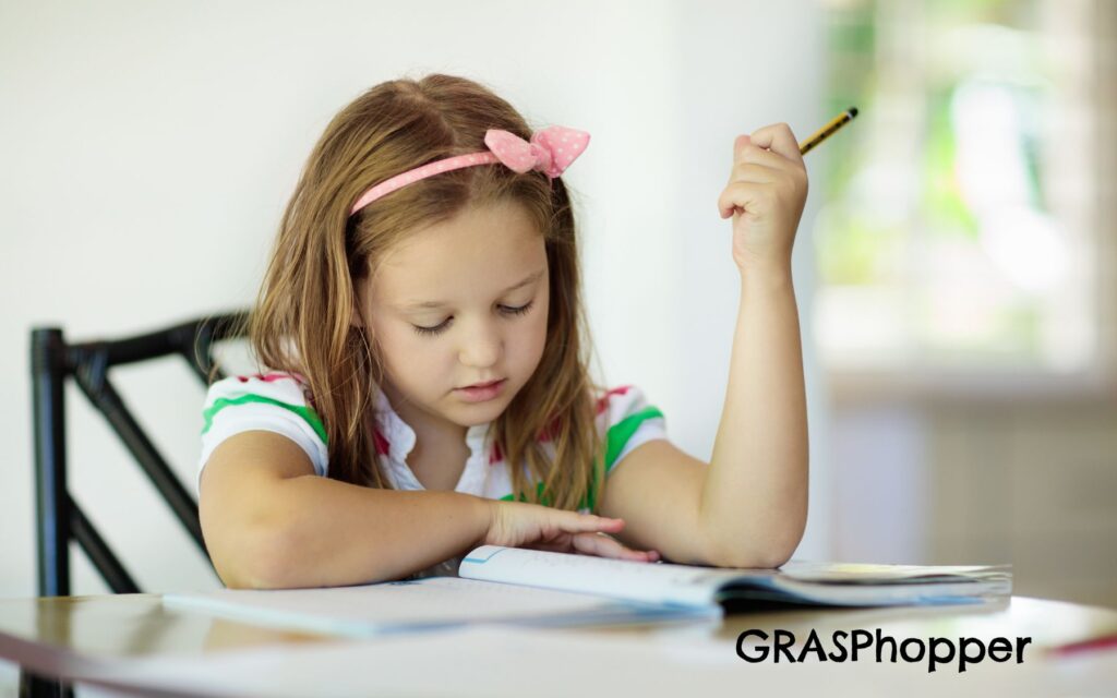 Image shows a girl reading a book to show her trying to learn main idea with one of the 5 Easy strategies for Teaching Main Idea 